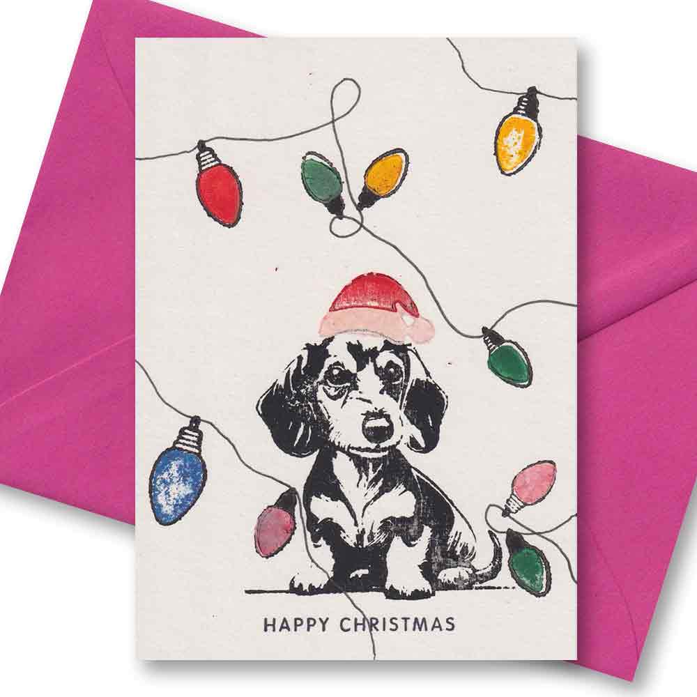 Handgedruckte Postkarte I Weihnachtsdackel mit Lichterkette