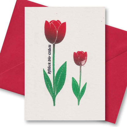 Rote Tulpen mit grünen Blättern und Text „Pflück Dir Glück“ auf cremefarbenem Papier – einzigartigbunt