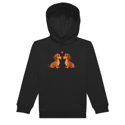 Kinder Hoodie in nachhaltiger Qualität mit handgedrucktem Motiv zweier Dackel, die sich anschauen, platziert auf der Brust.